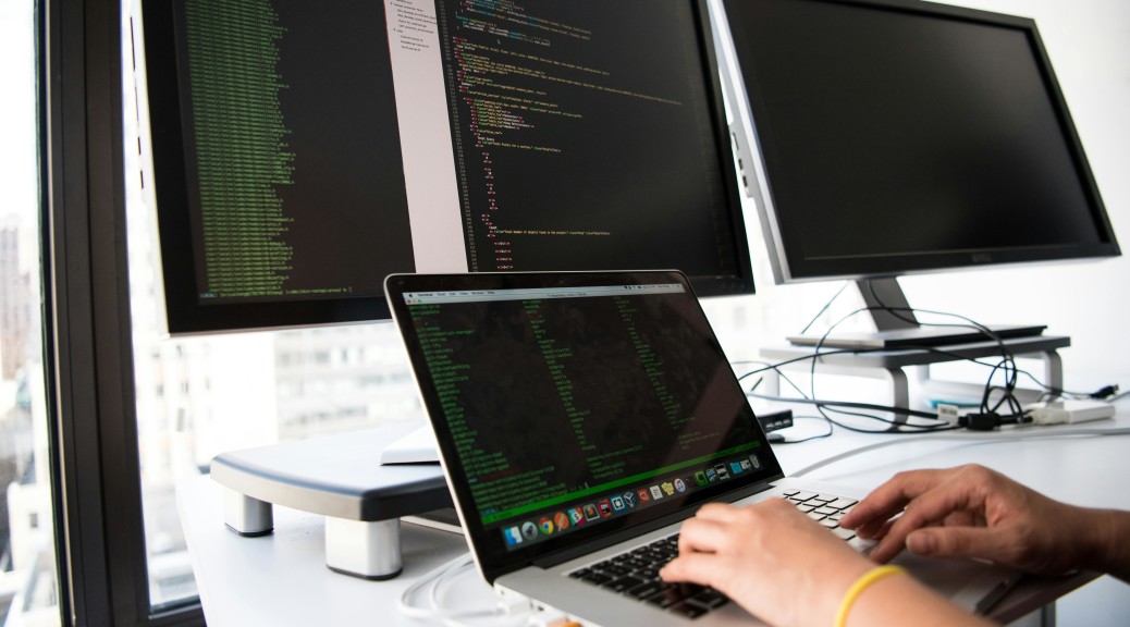 hands keyboard computers gray black green